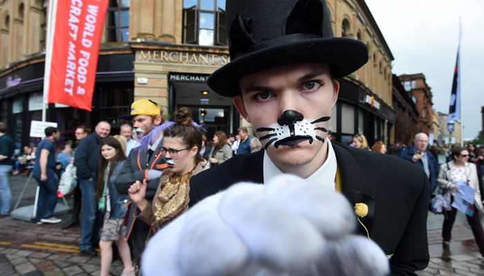Person dressed as a cat and wearing a top hat, at Merchant City Festival