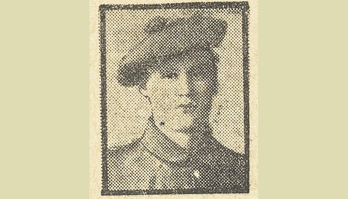 Photograph of a young man in military uniform.