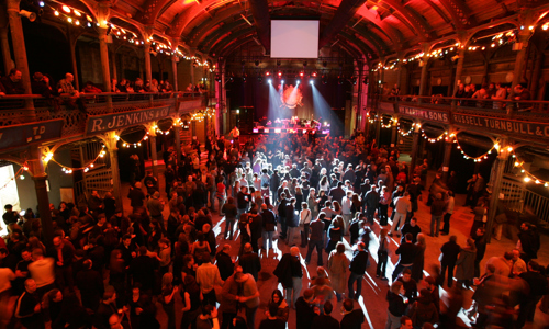 Large crowd at Old Fruitmarket music venue with atmospheric lighting