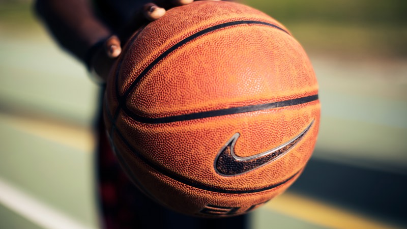 close up of orange basketball with Nike tick