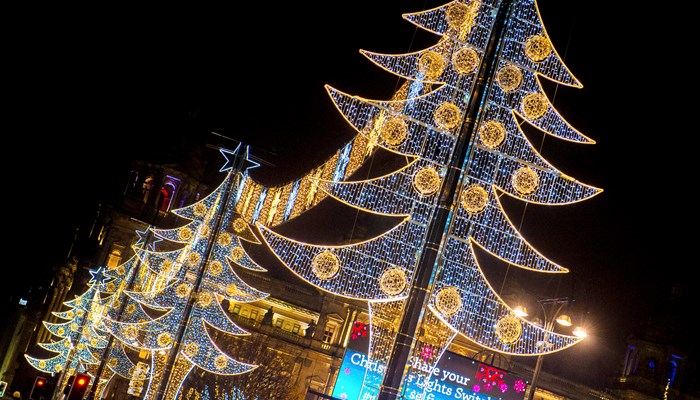 Christmas tree decorations all light up with festive lights on Glasgow's George Square