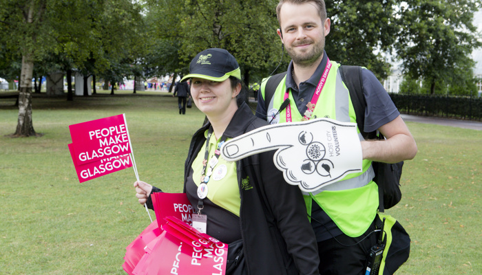 Two Host City volunteers with People Make Glasgow merchandise in Glasgow Green during the Glasgow 2014 Commonwealth Games.