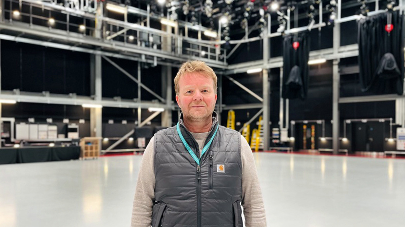 Photograph of Stuart Guinea in the TV studio at Kelvin Hall