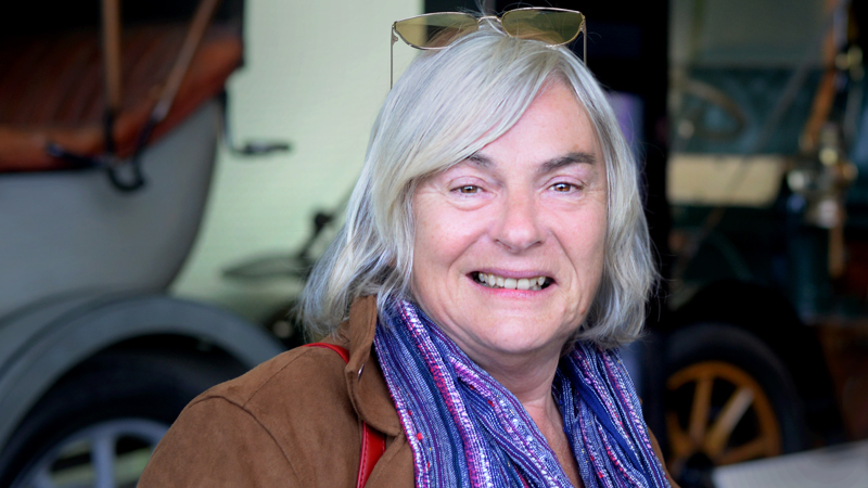 Photograph of the comedian, writer and broadcaster Susan Morrison standing inside Riverside Museum