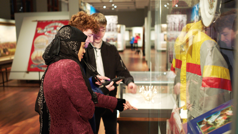 Photograph showing young people using My Stories in Kelvingrove Museum and Art Gallery