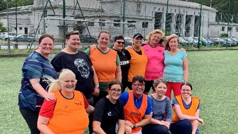 A group of people after a Walking Football session at the Palace of Art