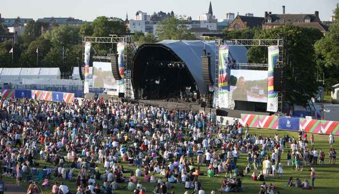 An aerial view of crowds in front of a large stage at the fan zone in Glasgow Green during the 2014 Commonwealth Games.