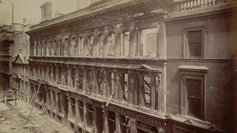 sepia photograph of the remnants of a burnt out warehouse