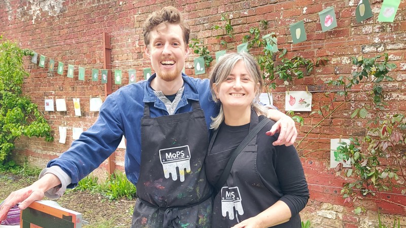 The artist Deirdre Nelson poses with a screenprinting colleague