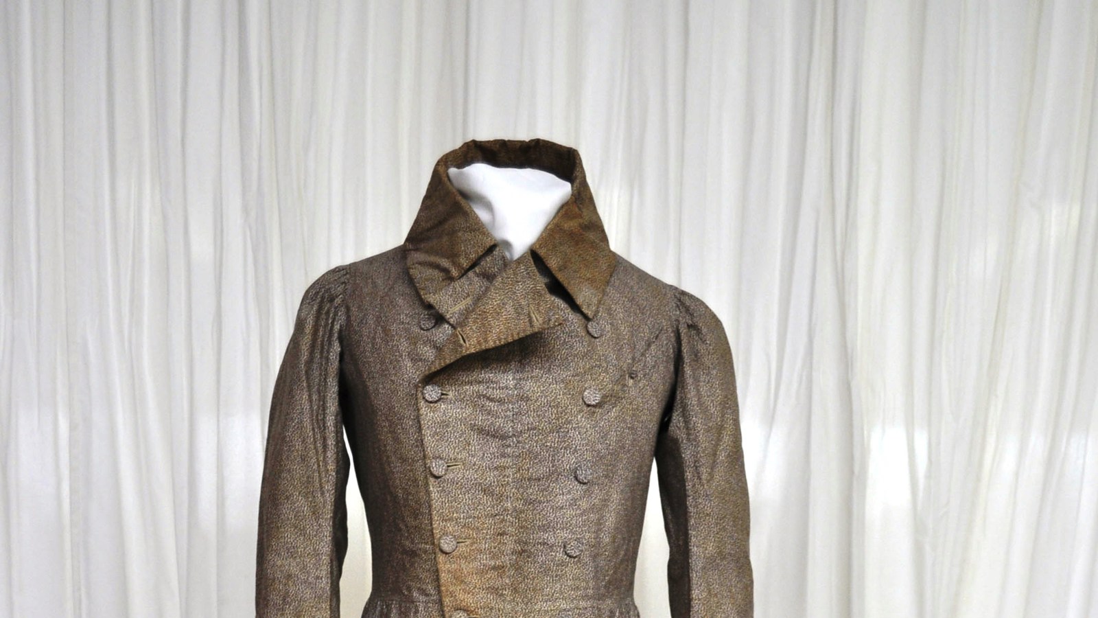 Photograph of 19th century mans coat on a mannequin