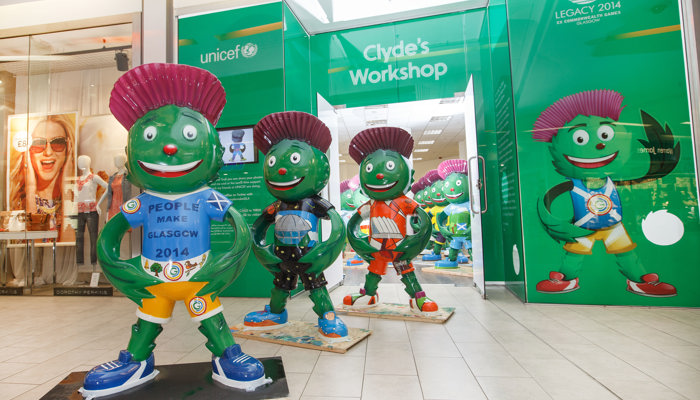 Three Clyde mascot statues in front of a shop called Clyde's workshop.