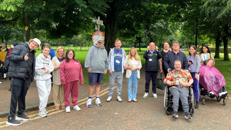 Group of people with mixed abilities in a park