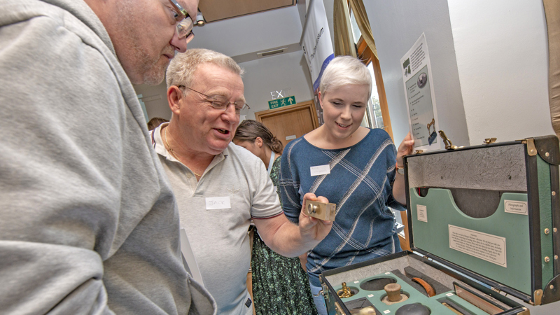 Photograph showing individual people at an event run by The Open Museum.