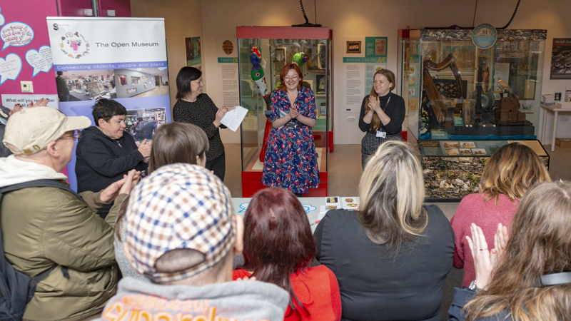 Photographs showing The Open Museum in action in a local community centre.