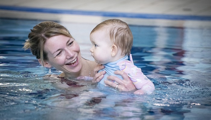 A parent and child during a swimming lesson