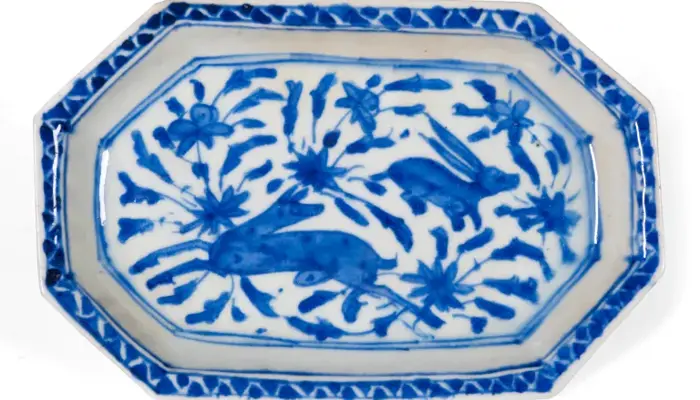 photograph of an oblong plate with cobalt blue design.