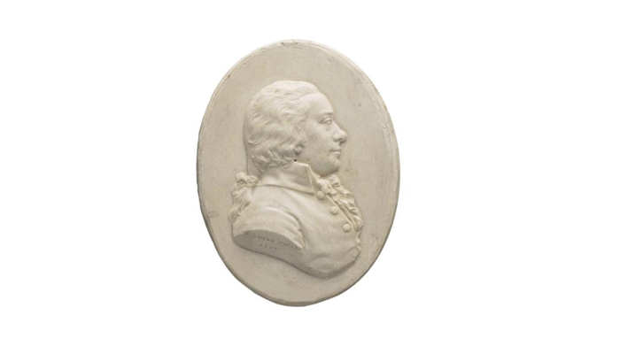 a bas-relief medallion showing the figurehead of an important person