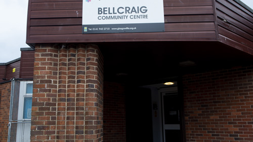 brown brick building with a sign saying bellcraig community centre above the door