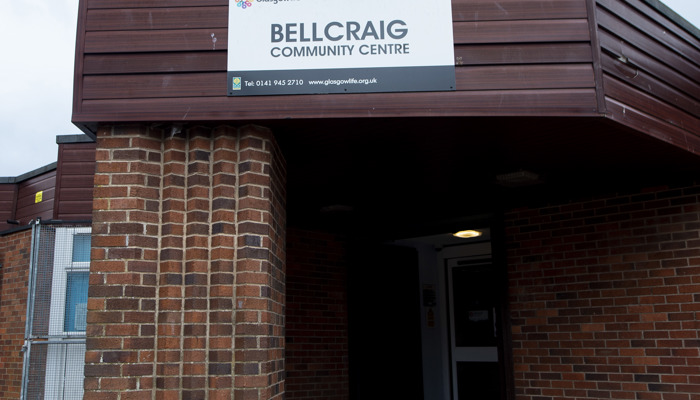 brown brick building with a sign saying bellcraig community centre above the door