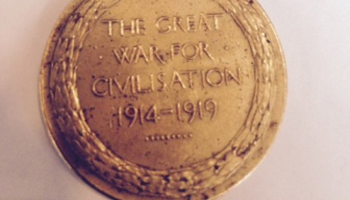 Thomas Moran's medal, which is gold with a rainbow coloured lanyard, for The Great War of Civilisation 1914-1919, inscribed with Thomas’ name and regimental number. 