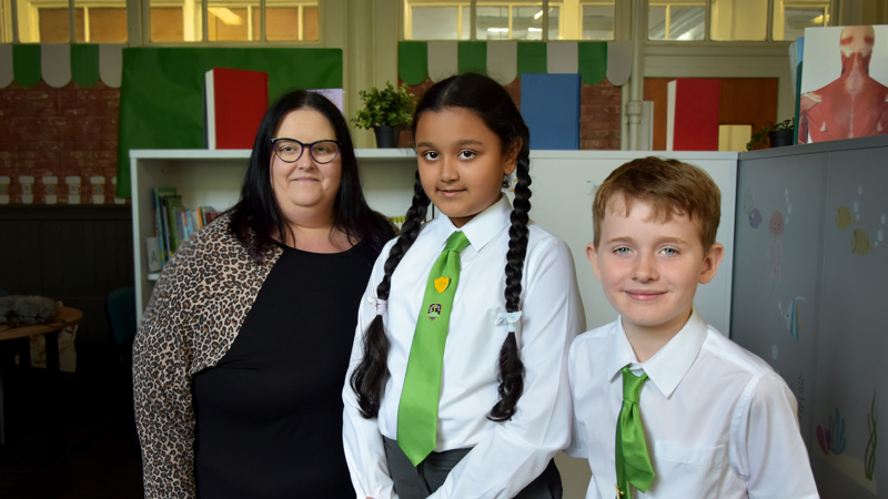 Photograph showing Glasgow Life Learning and Access Curator Caroline Currie with two pupils from St Convols