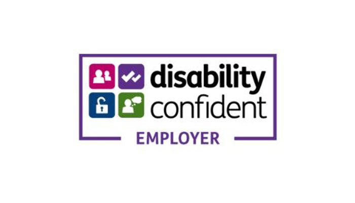 Purple rectangle with the words "Disability Confident Employer" in white text. Inside the rectangle are four smaller colored squares, each with a different symbol: a person with a tick, a lock, a person with a speech bubble, and a person with a walking stick.