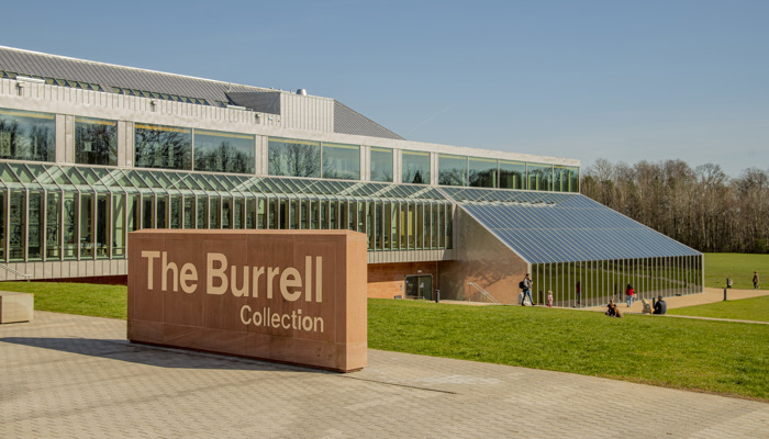 An exterior shot of the refurbished Burrell Collection building on a sunny day in Pollok Country Park.