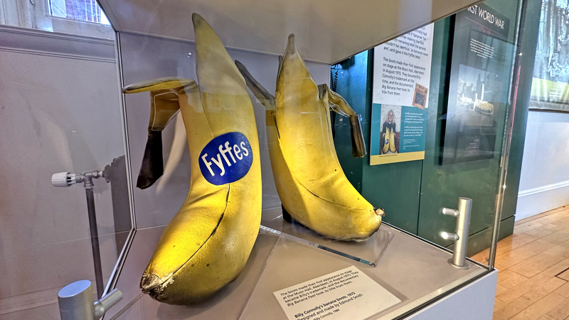 Photograph showing the comedian Billy Connolly's 'Banana Boots' which he used to wear on stage, and donated to the People's Palace.